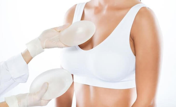 Woman's breasts start leaking after massive breast implants - DNB